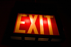 Exit sign with bulb and battery backup